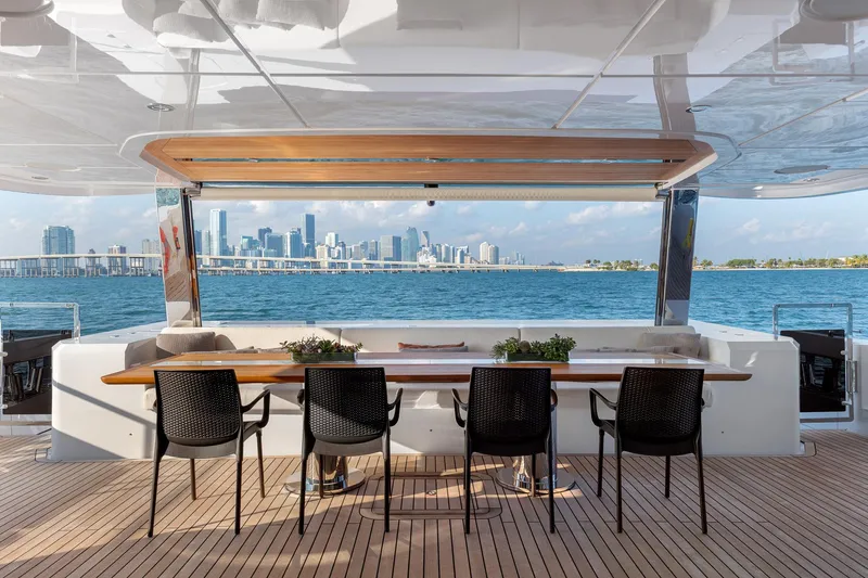 Rocket One Yacht Photos Pics Luxury yacht Gulf Craft Majesty 120, 2022 model, with elegant deck and city skyline view.