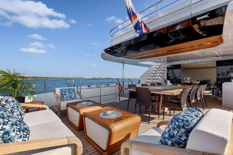 Rocket One Yacht Photos Pics Luxurious outdoor deck of 2022 Gulf Craft Majesty 120 yacht with seating and dining area.