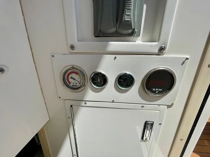 My Way Yacht Photos Pics Control panel of a 1998 Viking 50 Convertible boat with gauges and RPM display.