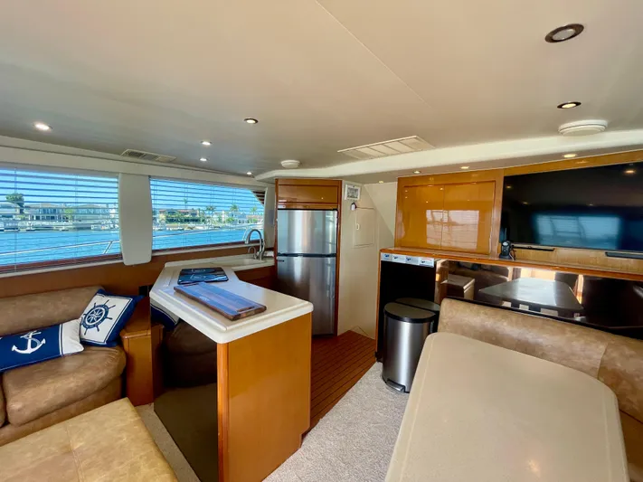My Way Yacht Photos Pics Interior of 1998 Viking 50 Convertible yacht with modern kitchen and seating area.