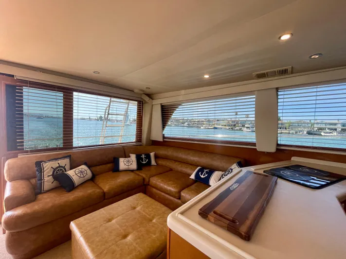 My Way Yacht Photos Pics Luxurious interior of 1998 Viking 50 Convertible yacht with leather seating and nautical decor.