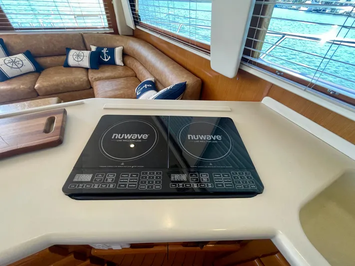My Way Yacht Photos Pics Modern kitchen in 1998 Viking 50 Convertible yacht with NuWave cooktop.