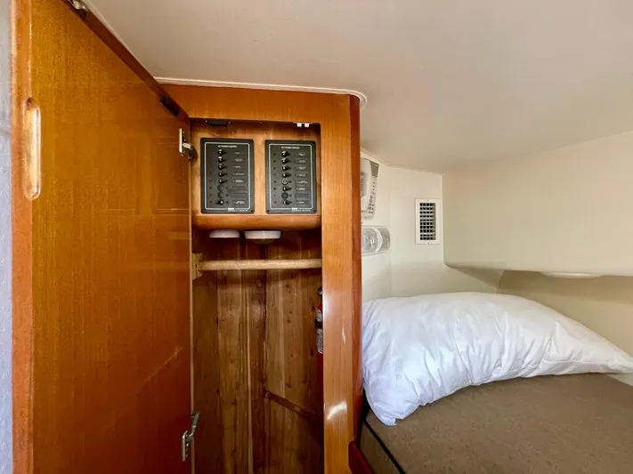 My Way Yacht Photos Pics 1998 Viking 50 Convertible cabin interior with wooden closet and control panels.