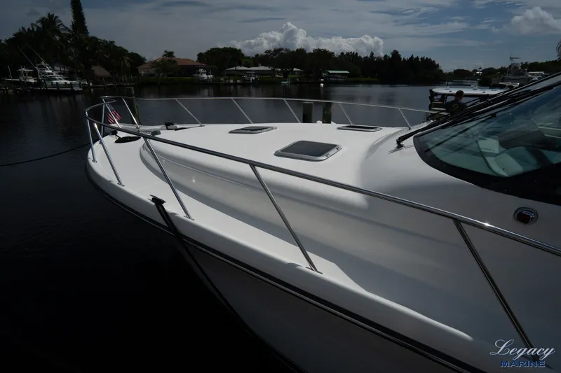 Legacy Yacht Photos Pics 2003 Tiara Yachts 4200 Open docked, showcasing sleek design and polished finish.