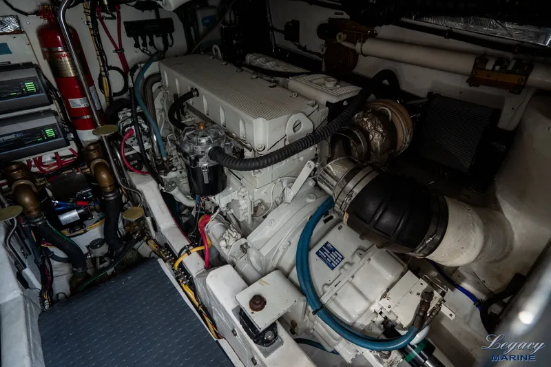 Legacy Yacht Photos Pics Engine room of a 2003 Tiara Yachts 4200 Open, showcasing mechanical components and wiring.