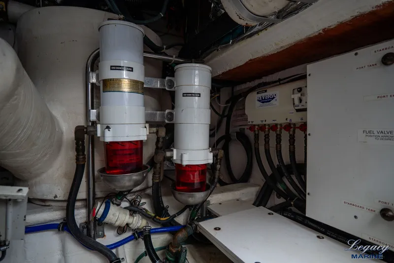 Legacy Yacht Photos Pics Engine room of 2003 Tiara Yachts 4200 Open, featuring fuel filters and valves.