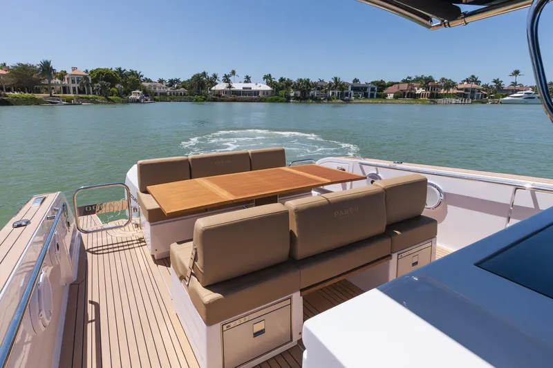  Yacht Photos Pics Luxury Pardo Yachts 38, 2025 model, cruising on a serene waterway with elegant seating.