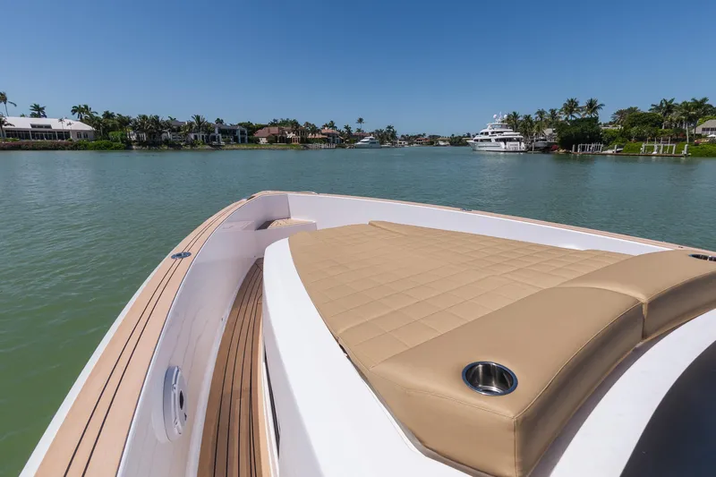  Yacht Photos Pics 2025 Pardo Yachts 38 cruising on a serene waterway with luxurious deck seating.