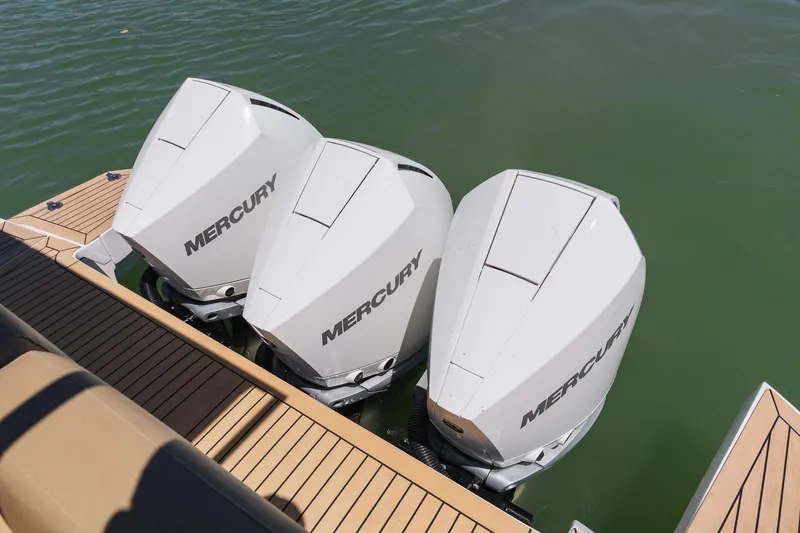  Yacht Photos Pics Three Mercury outboard engines on a 2025 Pardo Yachts 38, docked on calm water.