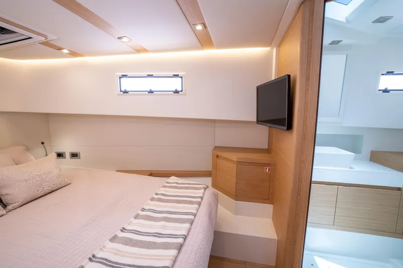 Yacht Photos Pics Luxurious interior of 2025 Pardo Yachts 38, featuring modern design and cozy bedding.