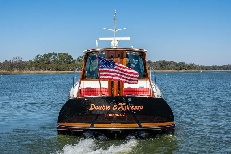 Double Expresso Yacht Photos Pics Hinckley Talaria 44 MY 2006 yacht "Double Expresso" cruising with American flag.