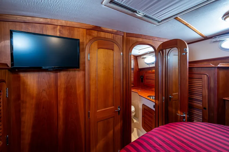 Double Expresso Yacht Photos Pics Interior of 2006 Hinckley Talaria 44 MY yacht with wood paneling and TV.