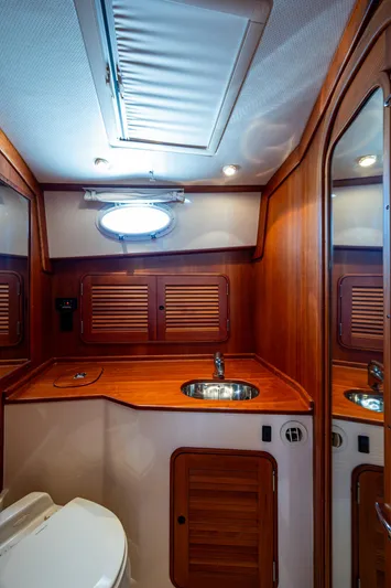 Double Expresso Yacht Photos Pics Luxurious 2006 Hinckley Talaria 44 MY yacht bathroom with wood accents and modern fixtures.