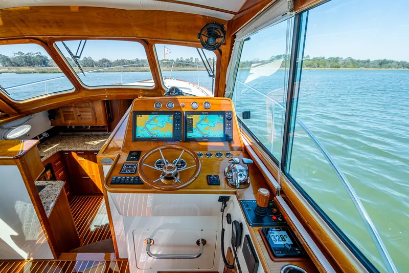 Double Expresso Yacht Photos Pics Helm of 2006 Hinckley Talaria 44 MY with dual navigation screens and wooden interior.