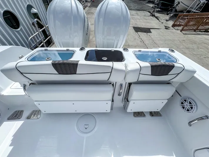  Yacht Photos Pics 2025 Wellcraft 302 Fisherman boat interior with dual seats and storage compartments.