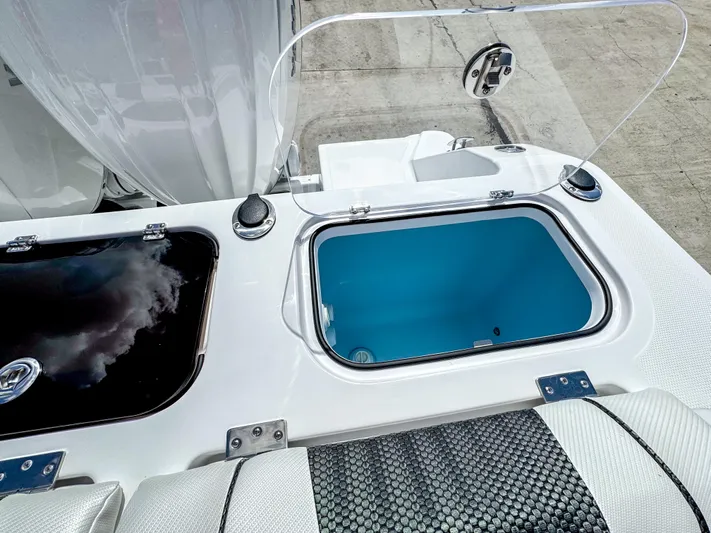  Yacht Photos Pics Livewell and storage compartments on 2025 Wellcraft 302 Fisherman boat.
