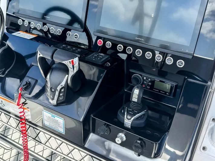  Yacht Photos Pics 2025 Wellcraft 302 Fisherman dashboard with advanced controls and navigation screens.