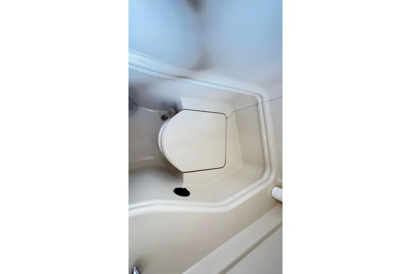  Yacht Photos Pics 2005 Sea Ray 340 Sundancer boat interior with compact bathroom area.