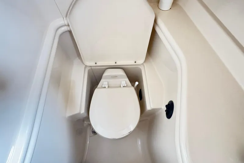  Yacht Photos Pics 2005 Sea Ray 340 Sundancer boat bathroom with compact toilet design.