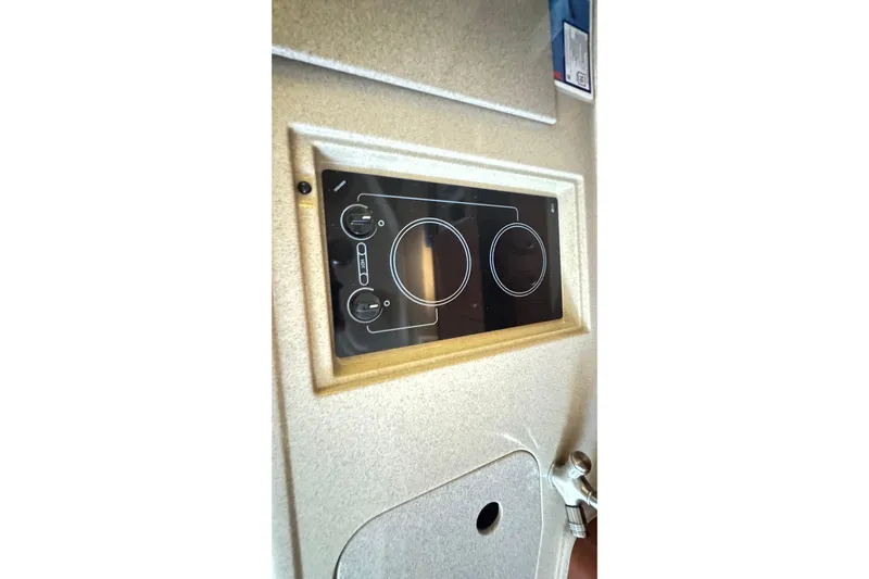  Yacht Photos Pics Control panel of a 2005 Sea Ray 340 Sundancer boat interior.