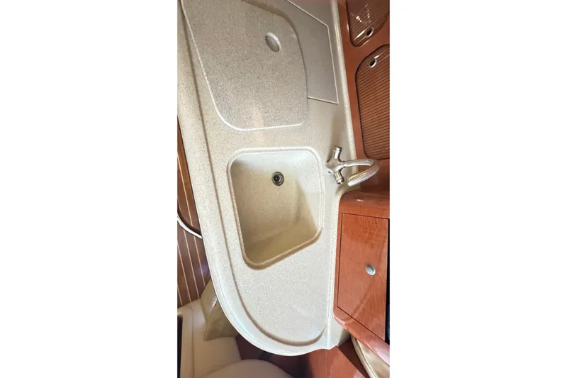  Yacht Photos Pics 2005 Sea Ray 340 Sundancer interior sink and countertop in cabin area.