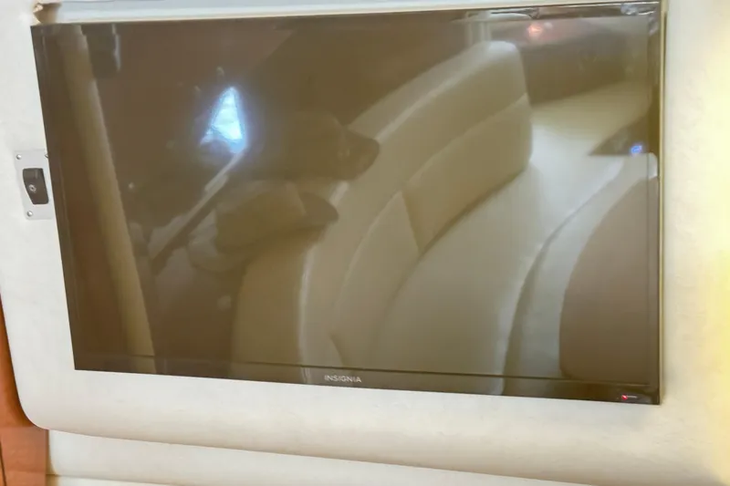  Yacht Photos Pics Insignia TV inside 2005 Sea Ray 340 Sundancer yacht, reflecting interior seating.