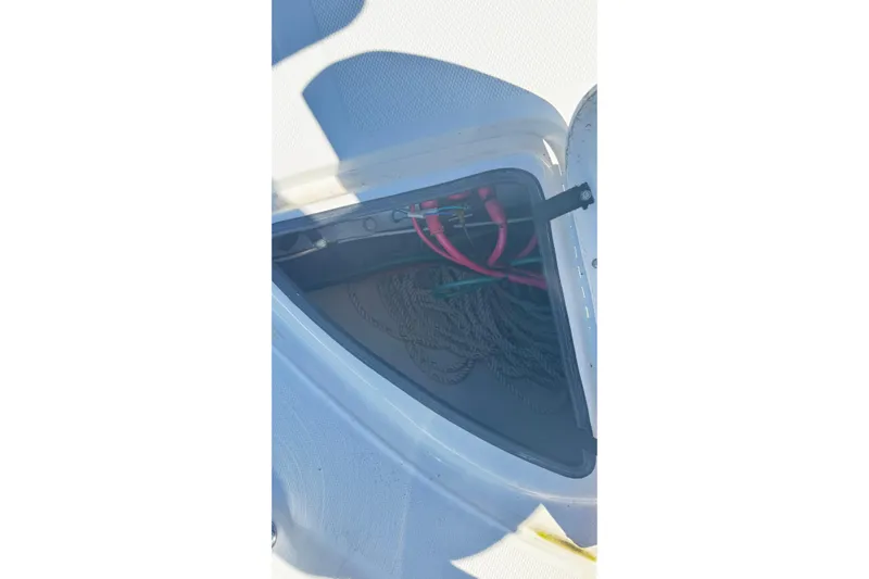  Yacht Photos Pics Storage compartment on a 2005 Sea Ray 340 Sundancer boat, containing ropes and cables.