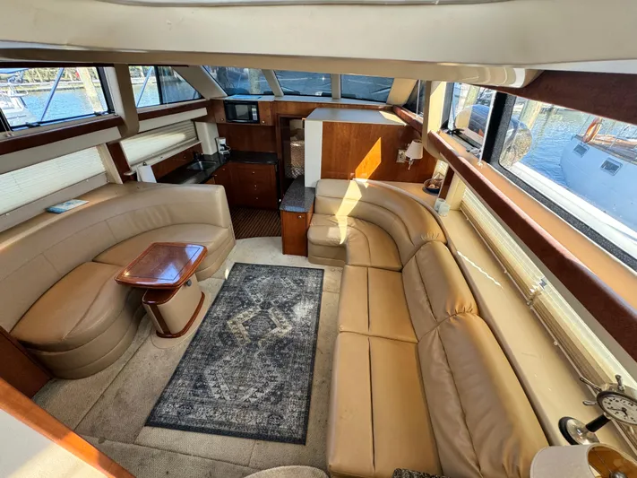Full House Yacht Photos Pics Luxurious interior of a 2006 Meridian 368 Motoryacht with plush seating and elegant decor.