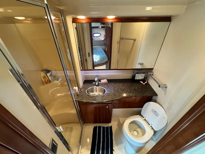 Full House Yacht Photos Pics Luxurious bathroom in 2006 Meridian 368 Motoryacht with modern fixtures and elegant design.