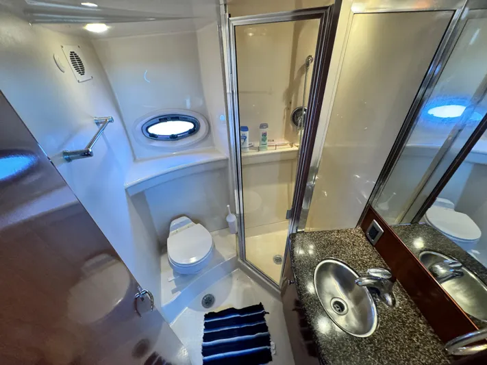 Full House Yacht Photos Pics Bathroom interior of 2006 Meridian 368 Motoryacht with shower, sink, and toilet.