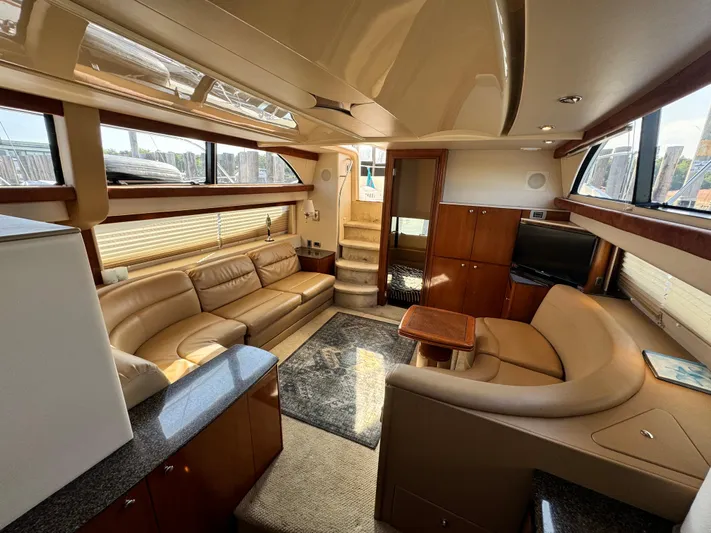 Full House Yacht Photos Pics Luxurious interior of a 2006 Meridian 368 Motoryacht with elegant seating and modern design.