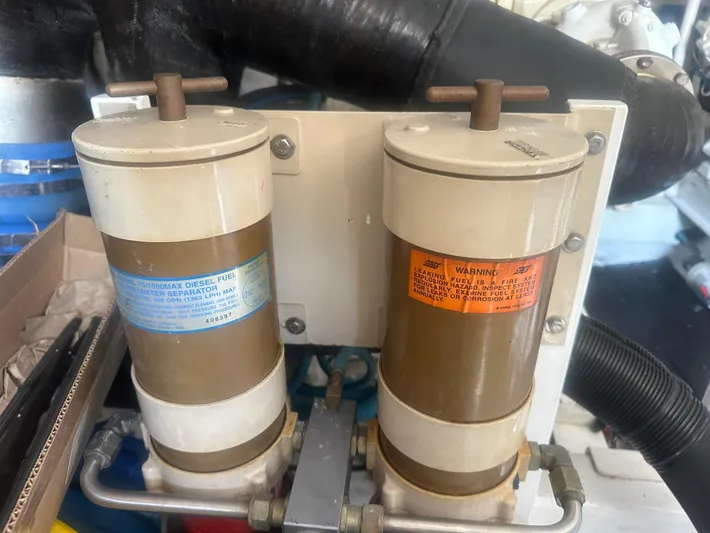 Gitana Yacht Photos Pics Diesel fuel water separators on a 2000 Viking Enclosed Flybridge boat engine.