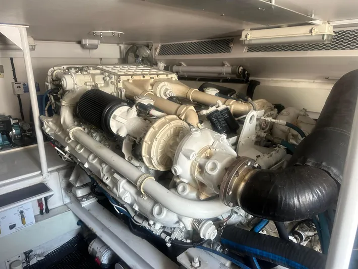 Gitana Yacht Photos Pics Engine room of 2000 Viking Enclosed Flybridge yacht, showcasing powerful marine engine components.