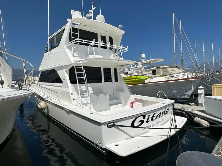 Gitana Yacht Photos Pics 2000 Viking Enclosed Flybridge yacht docked in marina, clear sky, Santa Barbara.