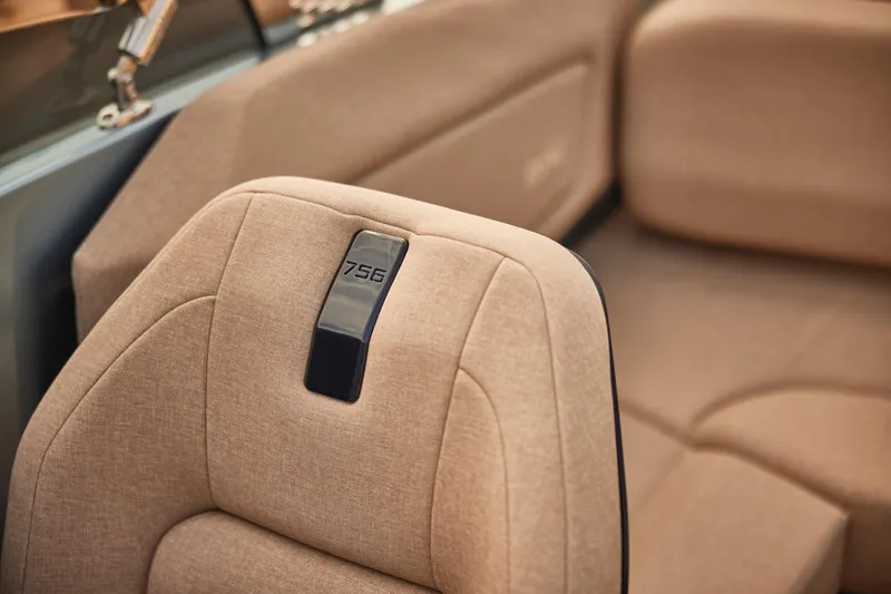  Yacht Photos Pics Luxurious interior of 2026 Flynt Yachts Speedera 26 OB with beige upholstery.