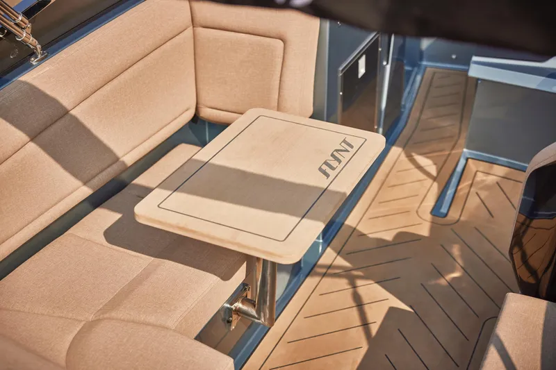  Yacht Photos Pics Luxurious interior of 2026 Flynt Yachts Speedera 26 OB with elegant seating and table.