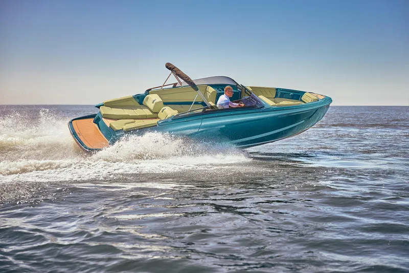  Yacht Photos Pics 2026 Flynt Yachts Speedera 26 OB cruising on open water, showcasing sleek design and performance.