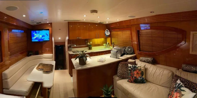  Yacht Photos Pics Luxurious interior of a 2005 Hatteras 50 Convertible yacht with modern amenities.