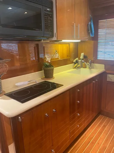  Yacht Photos Pics Luxurious kitchen in 2005 Hatteras 50 Convertible yacht with modern appliances.