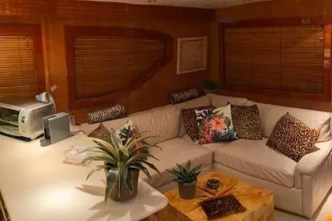  Yacht Photos Pics Luxurious interior of 2005 Hatteras 50 Convertible yacht with cozy seating and decor.