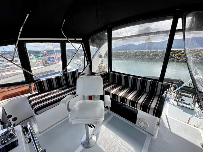 Rc Venture Yacht Photos Pics Cockpit of 1989 Ocean Alexander 44 yacht with striped seating and helm chair.