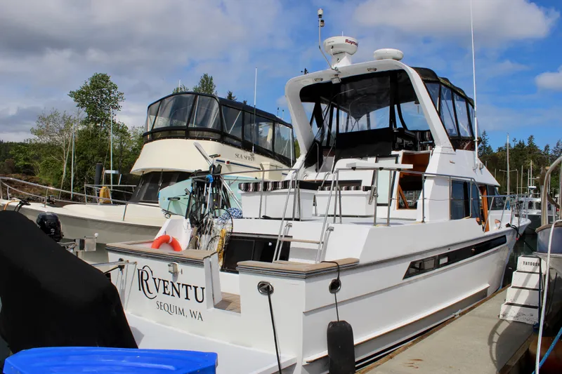 Rc Venture Yacht Photos Pics 1989 Ocean Alexander 44 yacht docked in Sequim, WA, under a partly cloudy sky.