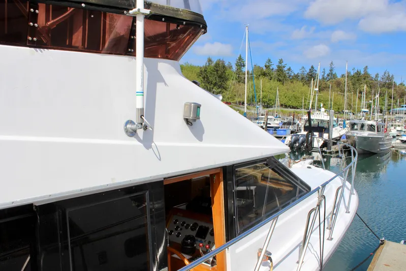 Rc Venture Yacht Photos Pics 1989 Ocean Alexander 44 yacht docked in a marina, surrounded by other boats.