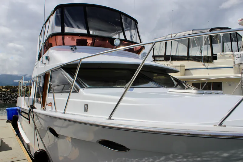 Rc Venture Yacht Photos Pics 1989 Ocean Alexander 44 yacht docked, showcasing sleek design and spacious upper deck.