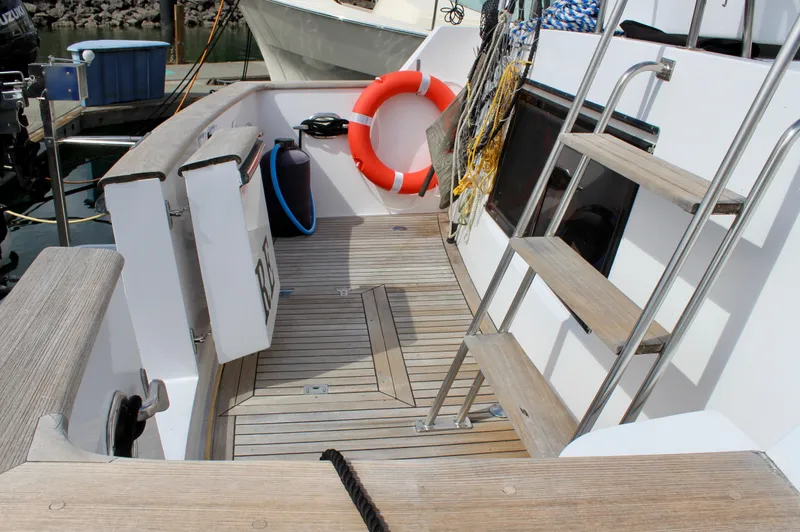 Rc Venture Yacht Photos Pics 1989 Ocean Alexander 44 yacht deck with wooden flooring and safety equipment.