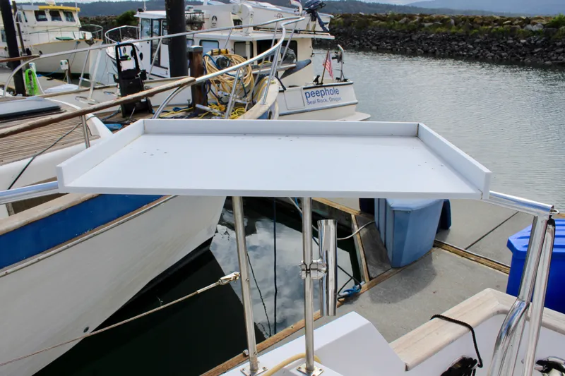 Rc Venture Yacht Photos Pics 1989 Ocean Alexander 44 yacht docked, featuring a white tray table on deck.