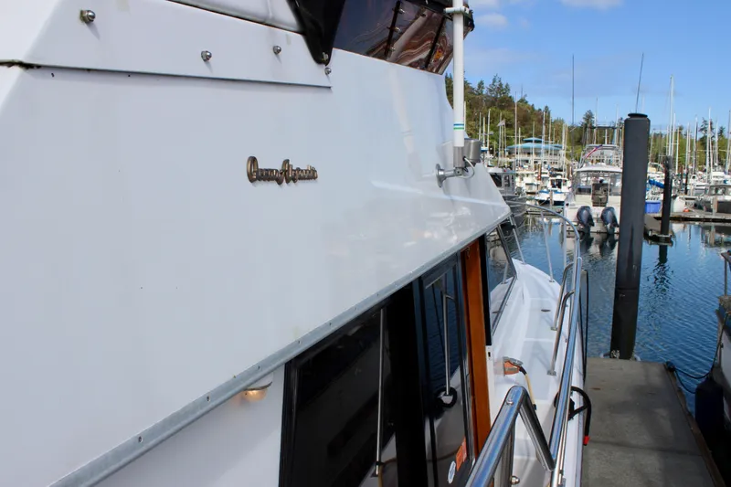Rc Venture Yacht Photos Pics 1989 Ocean Alexander 44 yacht docked at a marina, showcasing sleek design and craftsmanship.