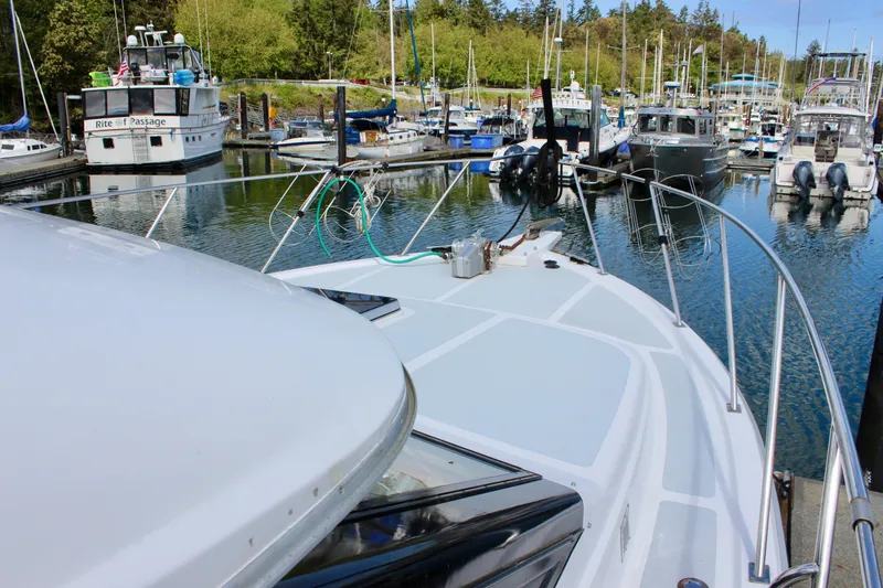 Rc Venture Yacht Photos Pics 1989 Ocean Alexander 44 yacht docked in a marina with surrounding boats.