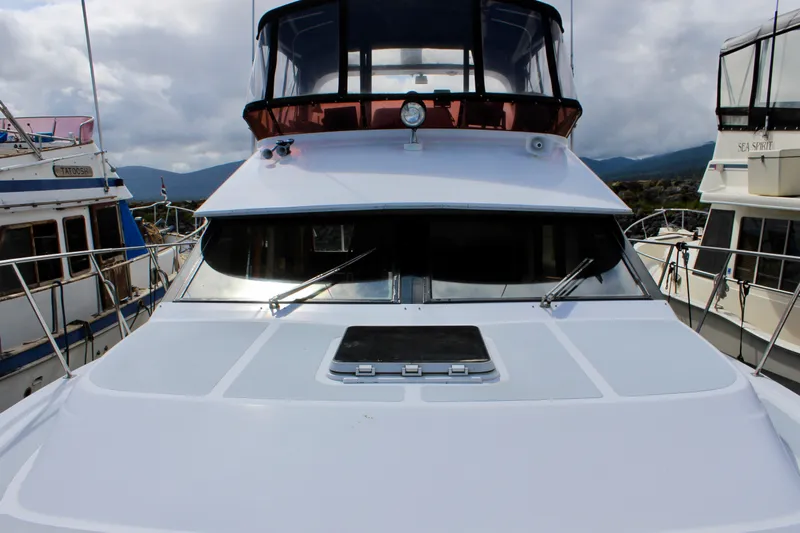 Rc Venture Yacht Photos Pics 1989 Ocean Alexander 44 yacht docked, showcasing sleek design and spacious deck.