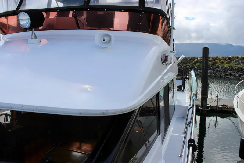 Rc Venture Yacht Photos Pics 1989 Ocean Alexander 44 yacht docked, showcasing sleek white exterior and spacious deck.